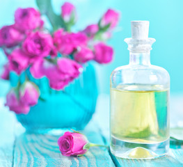 Fototapeta na wymiar rose oil in glass bottle