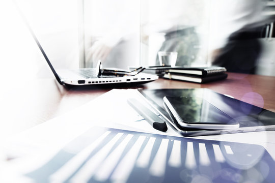 business documents on office table with smart phone and digital