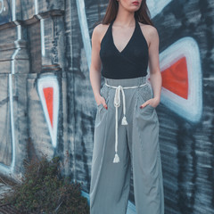 Beautiful brunette posing in an industrial context