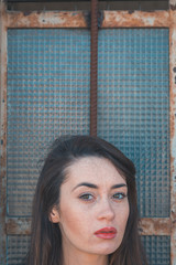 Beautiful brunette posing in an industrial context