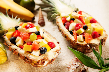 Healthy Fruit Salads on White Sand with Shells
