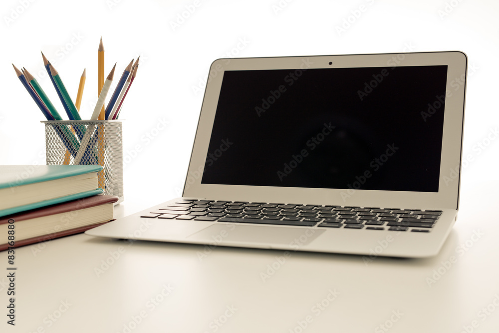 Wall mural still-life portrait of computer, pen, coffee mug on table, busin