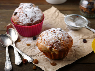 Two large muffins with raisins