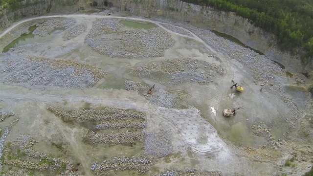 Pit on production of  stone with excavators. Aerial   panorama