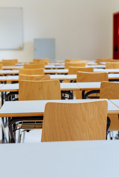 Desk and chairs in classroom