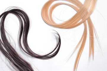 Cercles muraux Salon de coiffure Tufts of brown and blond straight hair
