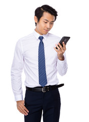 Businessman look at cellphone