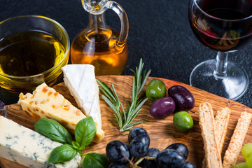 Tapas style board with cheese,olives and wine
