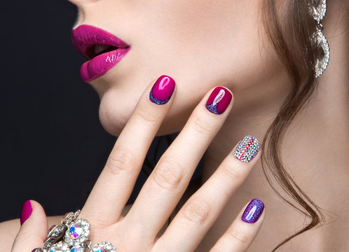 girl with a bright make-up and manicure with rhinestones. 