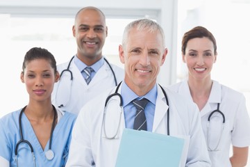 Fototapeta premium Team of smiling doctors looking at camera