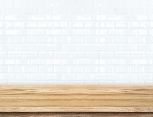 Empty wood table and ceramic tile brick wall in background. prod
