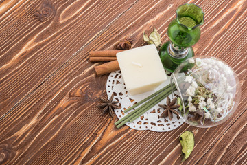 spa stuff on wooden background: candle, aroma