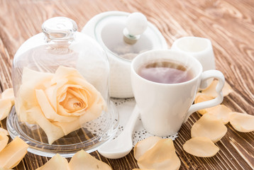Tea cups with teapot on old wooden table