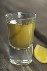 Tequila shot with lemon