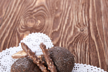 Cupcake with chocolate on wooden background