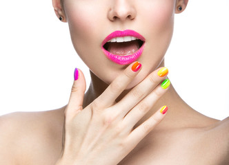 Beautiful girl with bright colored makeup and nail polish