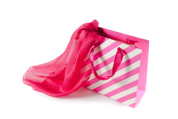 White-pink gift bag and   pink silk scarf isolated on white