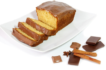 Cake with glaze of chocolate and spices  isolated on white