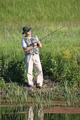 fisherman prepares for fishing on river