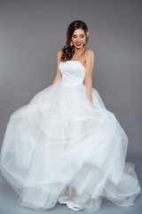 Fototapeta na wymiar Portrait of a Beautiful Bride Model in a White Wedding Dress