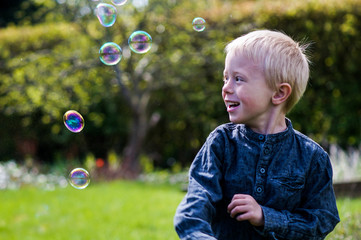 Child and Soap Bubbles