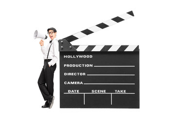 Young movie director speaking on a megaphone © Ljupco Smokovski