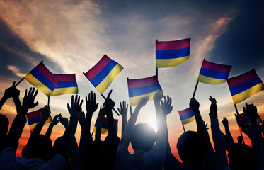 Group of People Waving Armenian Flags Back Lit