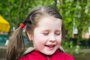 Portrait of a cheerful little girl