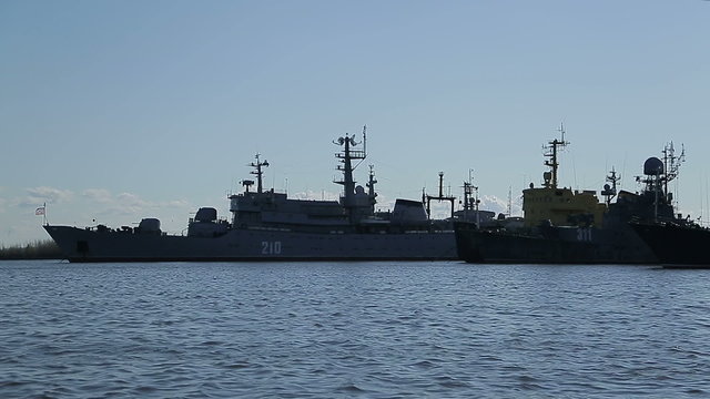 Silhouette row of warships in the Bay of Kronstadt 