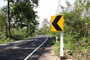 Road Signs warn Drivers for Ahead Dangerous Curve.