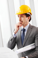 businessman in construction helmet