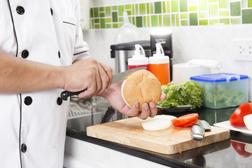 Chef shred burger bun with knife