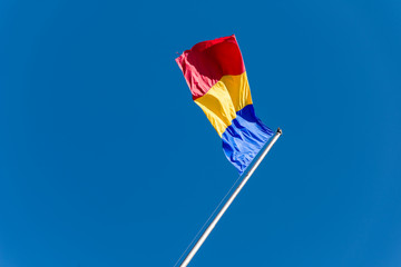 Flag Of Romania On Blue Sky