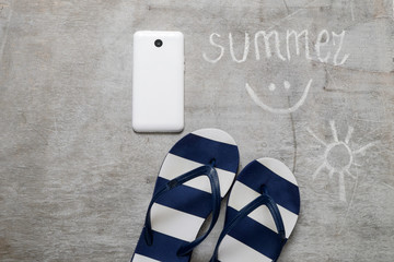 Blue flip flops Text summer on a wooden surface