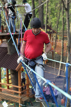 Man climbing in adventure park