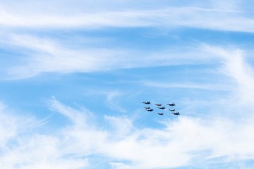 Fototapeta premium military low-flying aircrafts in white clouds