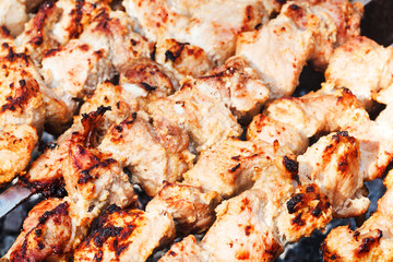 pieces of shish kebabs on skewers on brazier