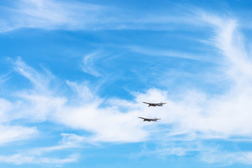 two strategic bomber aircrafts in white clouds