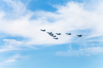 Obraz premium flight military fighter aircrafts in white clouds