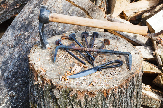 hew axe and metal hardware on wooden block