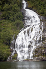 Mountains and waterfall, fjord Nærøyfjord in Gudvangen, Norway