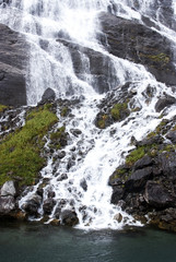 Naklejka na ściany i meble Mountains and waterfall, fjord Nærøyfjord in Gudvangen, Norway
