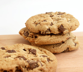 Stack of Chocolate chip cookies on wooden background