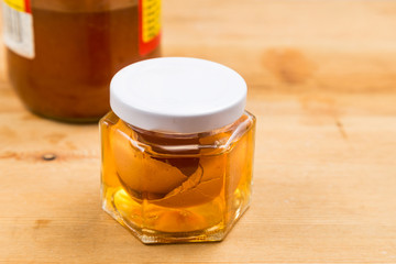 Jar containing apple cider vinegar soaked egg shells