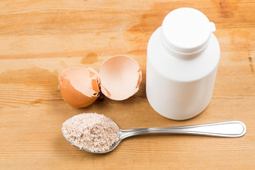 Fototapeta na wymiar Home-made calcium supplement from grounded egg shells