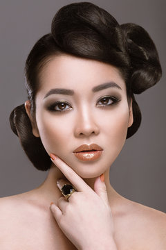 Oriental girl with evening hairstyle