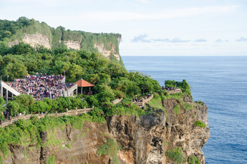 Fototapeta na wymiar Theatre at Uluwatu Temple, Bali, Indonesia - A scenic Uluwatu Cliff with pavilion and blue sea in Bali Indonesia..