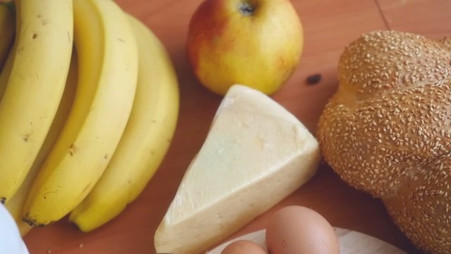 Slowmotion. Healthy breakfast on the table close up with cup of