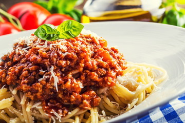 Spaghetti bolognese with sherry tomato and basil. 