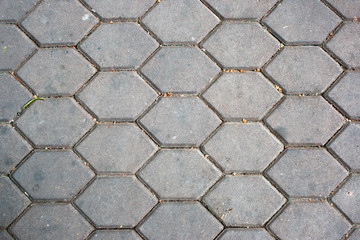 dirty patterned paving tiles